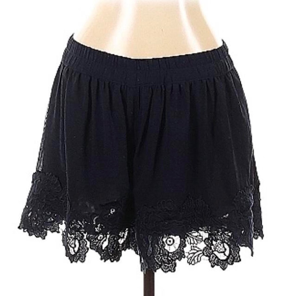 black mini skirt with elastic waist and embroidered lace hem